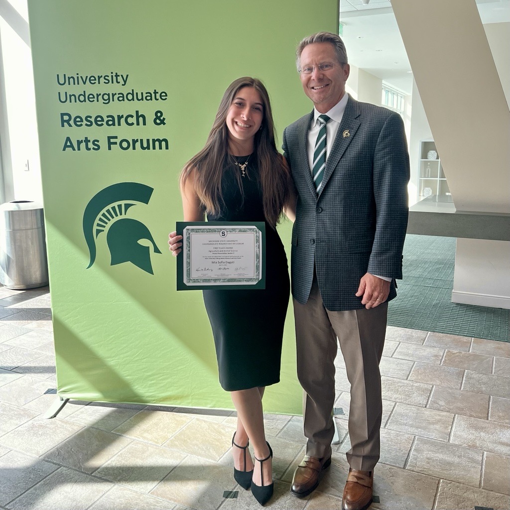 Accepting First Place award with MSU President Kevin Guskiewicz